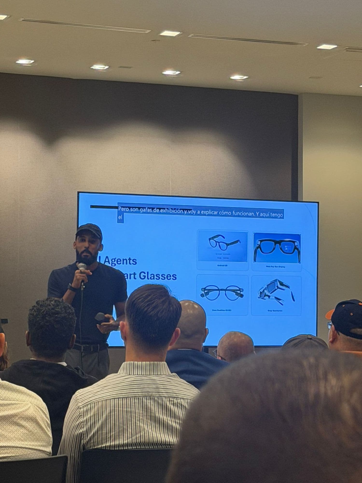 Speaker presenting AI agents and smart glasses at a PR AI Meetup